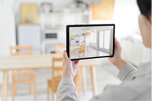 Digital marketer taking pics inside house